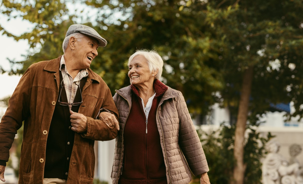 Loving senior couple enjoy a walk together